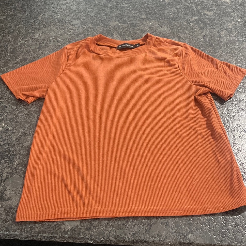 Burnt orange pretty little thing tee